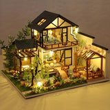 Miniature Wooden House Building Kit With Illuminated Interior - Image 1